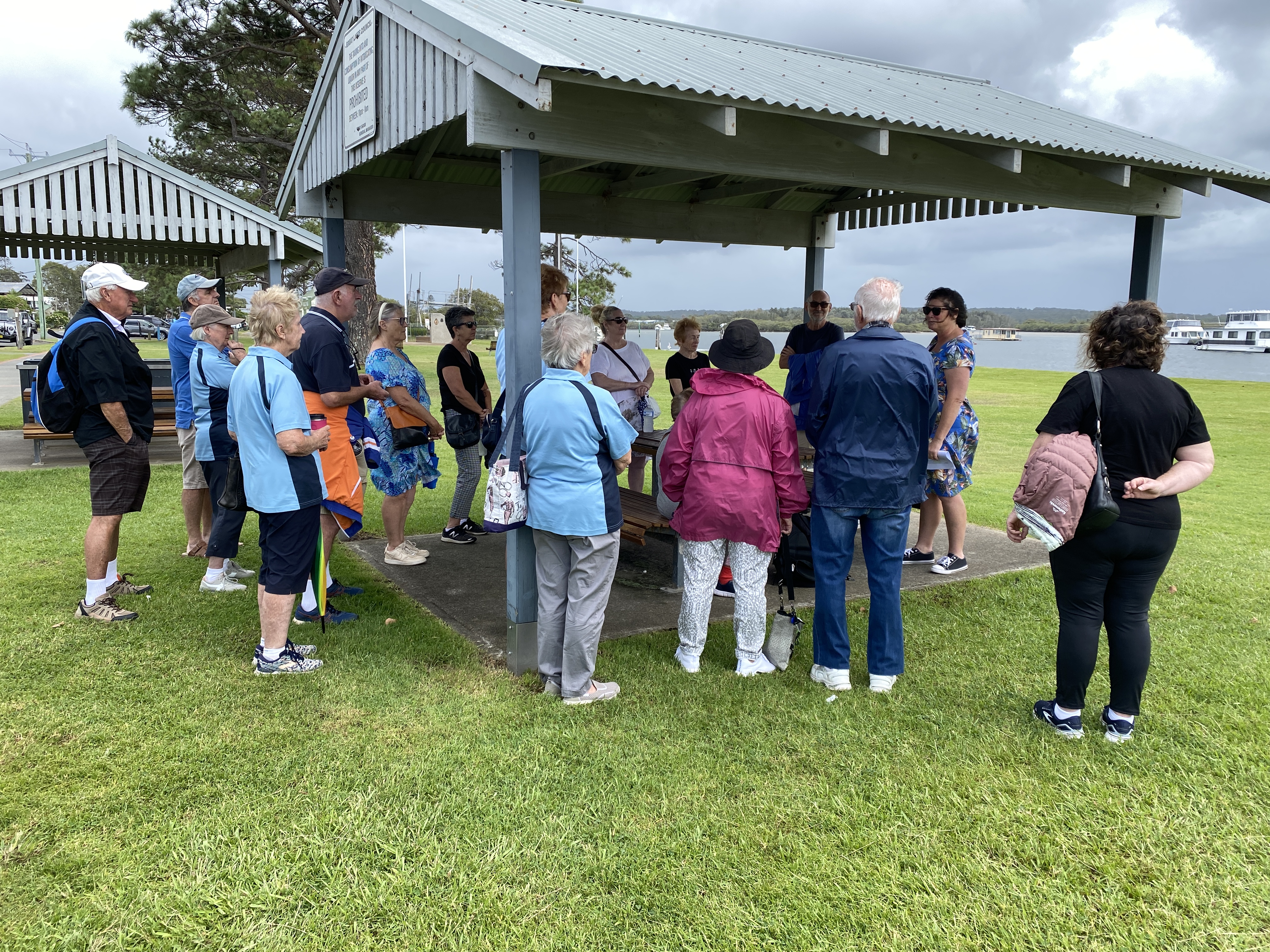 Janine Roberts on behalf of 'Midcoast Stories' taking some Seniors on a heritage walk along the waterfront at Tea Gardens for 'Seniors Week' organised by MidCoast Council.